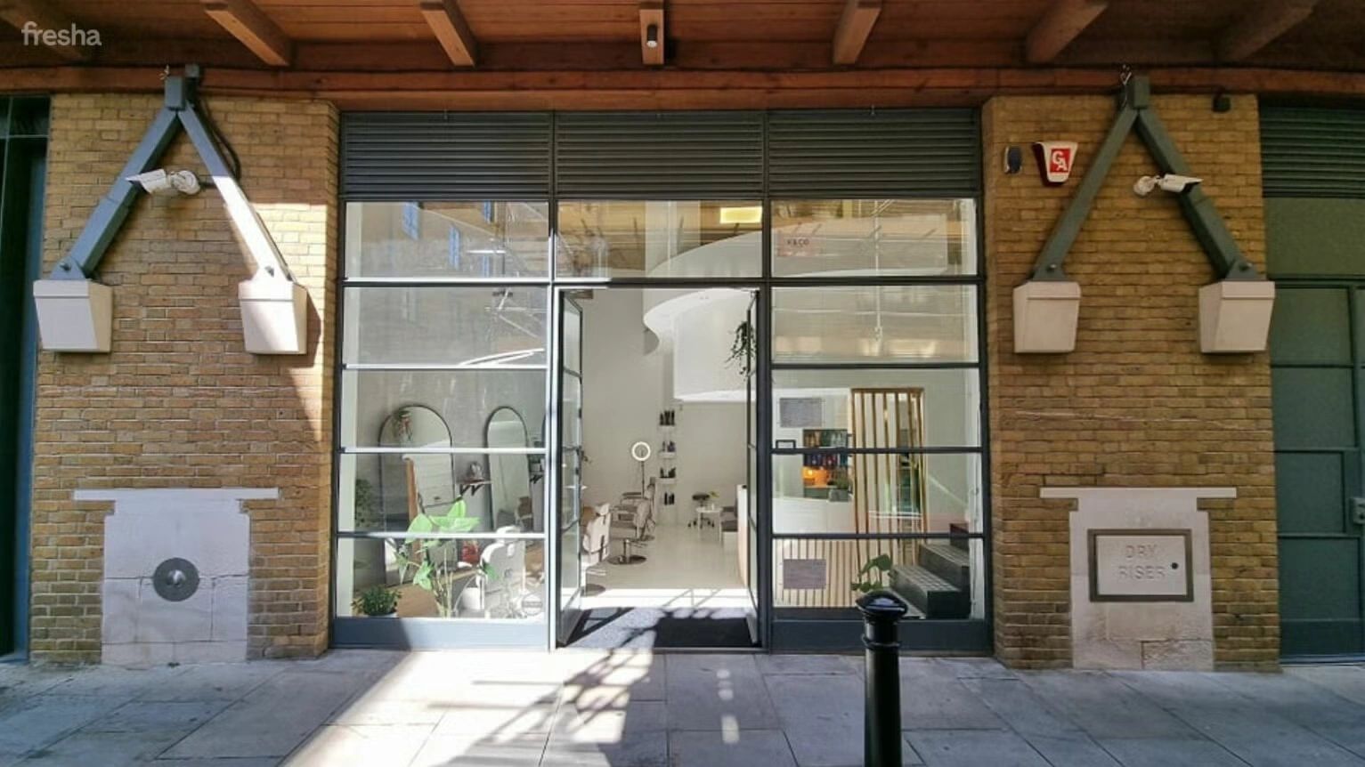 K&Co salon entrance on Shad Thames with glass frontage