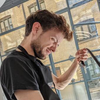 Kieran styling hair at K&Co